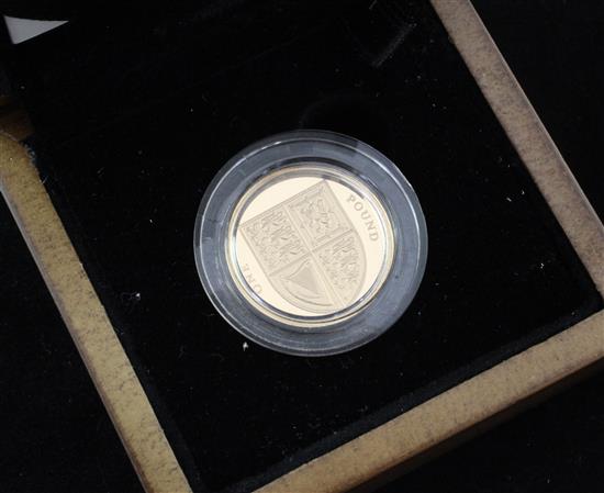 A cased Royal Mint 2008 Royal Shield of Arms £1 gold proof coin,